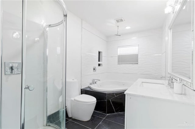 full bathroom featuring tile patterned floors, toilet, vanity, independent shower and bath, and tile walls