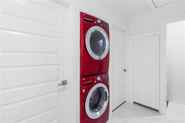 clothes washing area with stacked washer / drying machine