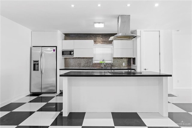 kitchen with sink, island exhaust hood, decorative backsplash, white cabinets, and appliances with stainless steel finishes