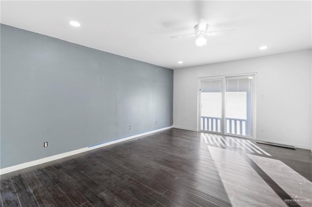 unfurnished room featuring ceiling fan and dark hardwood / wood-style flooring