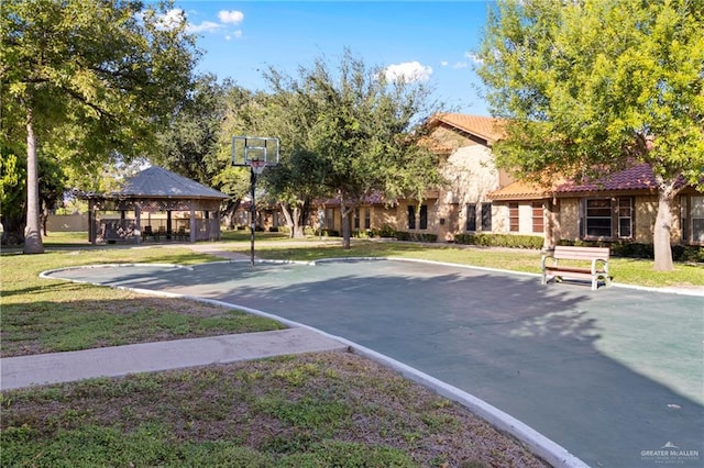 view of basketball court with a gazebo and a lawn