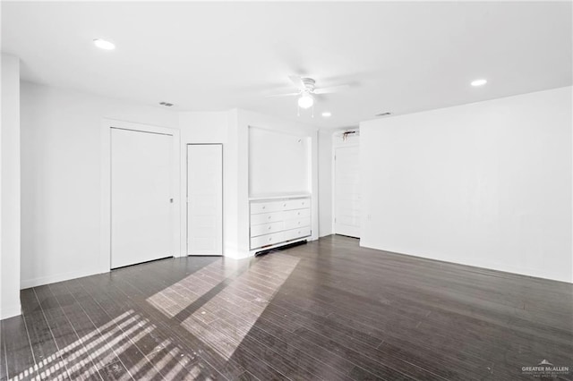 spare room featuring dark hardwood / wood-style floors and ceiling fan