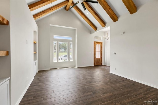 unfurnished living room featuring beamed ceiling, dark hardwood / wood-style floors, ceiling fan with notable chandelier, and high vaulted ceiling