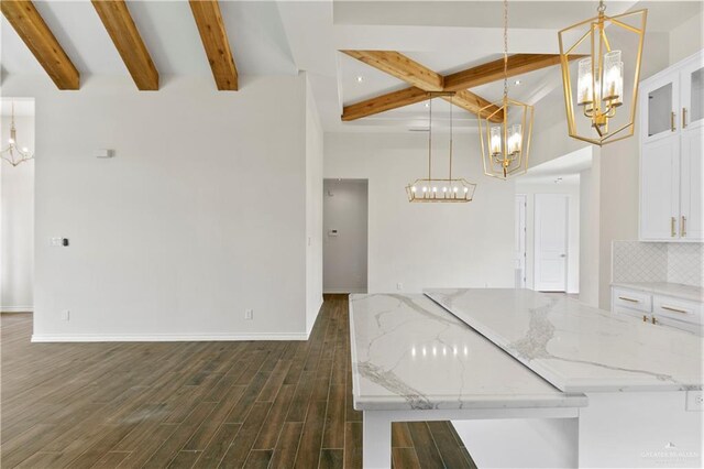 kitchen with white cabinets, hanging light fixtures, and dark wood-type flooring