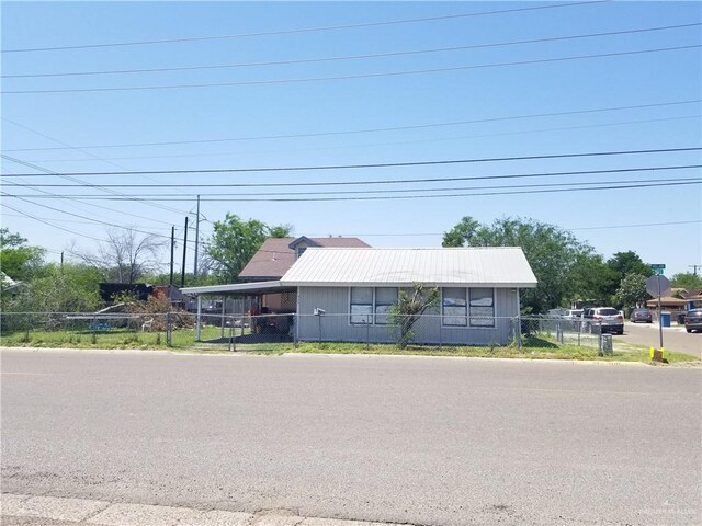 515 Holland Ave, Mission, TX 78572 - view of front facade with a carport and metal roof