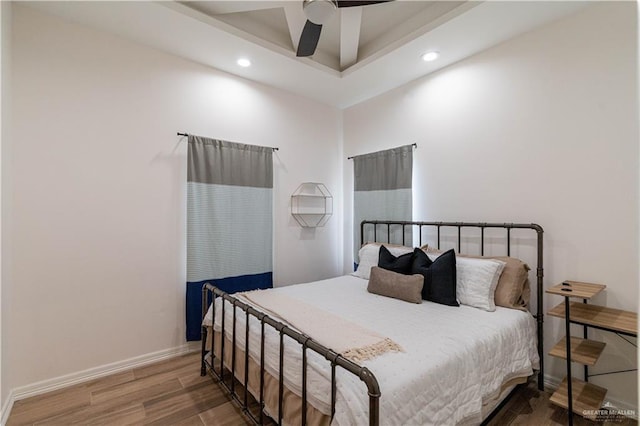 bedroom with hardwood / wood-style flooring and ceiling fan