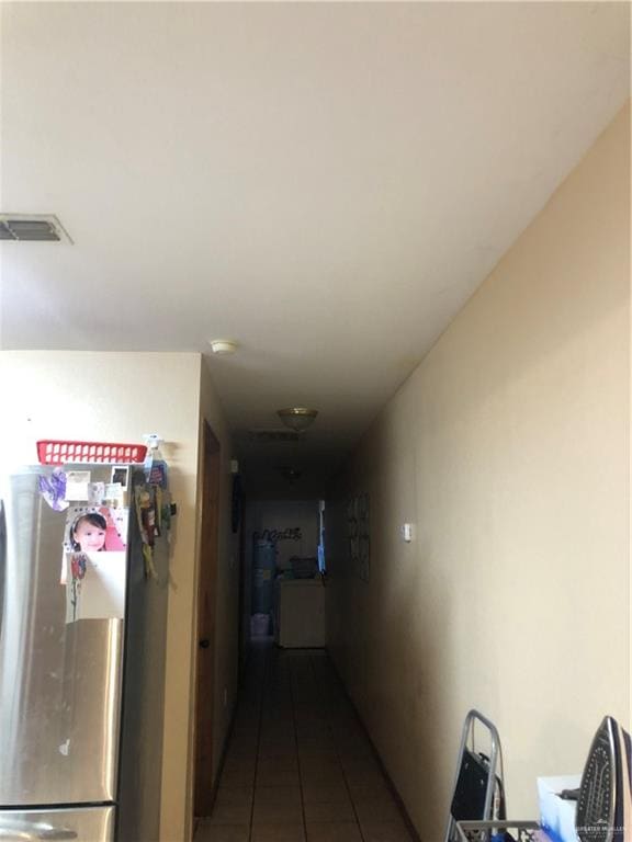 hallway featuring tile patterned floors