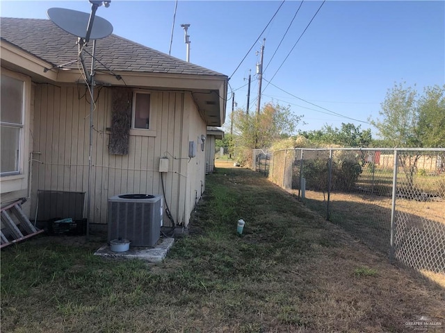 view of side of property with cooling unit