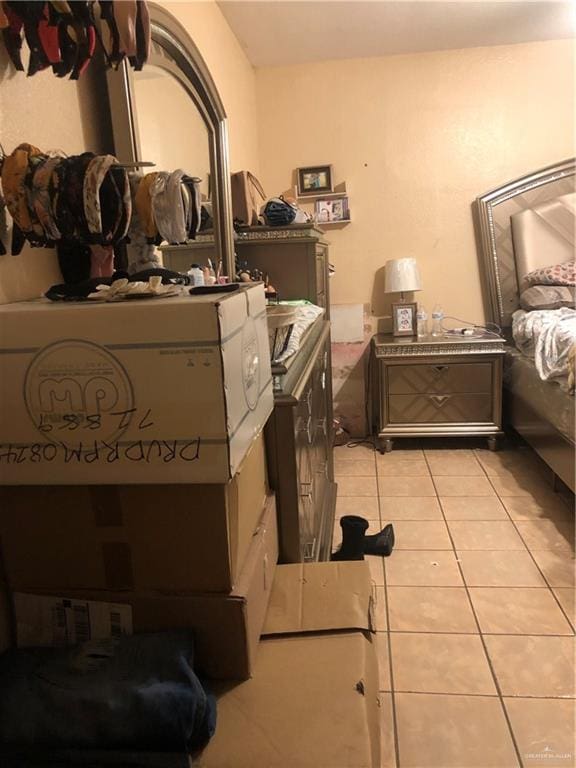 bedroom featuring light tile patterned floors