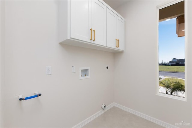 laundry room featuring cabinet space, hookup for a washing machine, baseboards, and electric dryer hookup