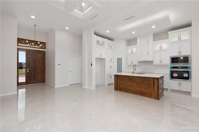 kitchen featuring recessed lighting, visible vents, white cabinetry, light countertops, and appliances with stainless steel finishes