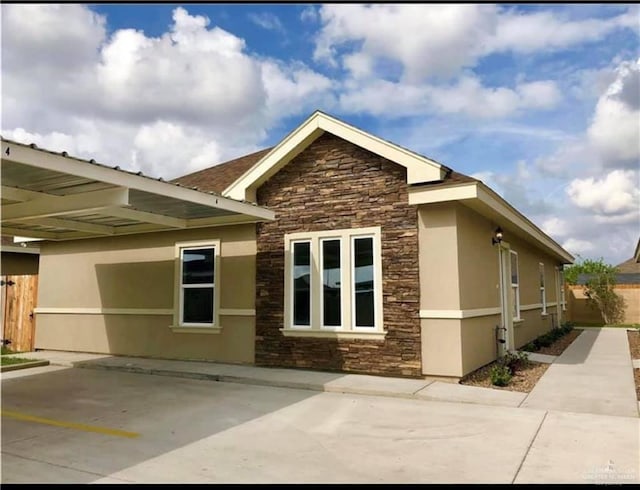 view of property exterior featuring a carport