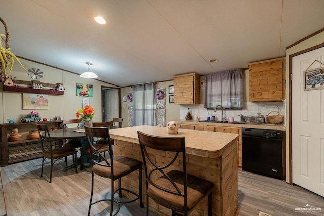 kitchen with light countertops, decorative backsplash, light wood-style floors, brown cabinetry, and dishwasher