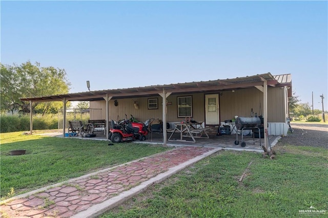 back of house with a yard