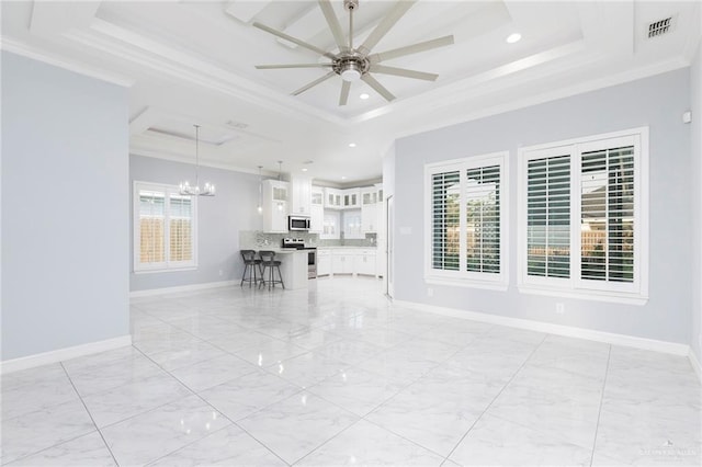 220 Stella Dr, San Juan, TX 78589 - living room with baseboards, ornamental molding, visible vents, and a raised ceiling