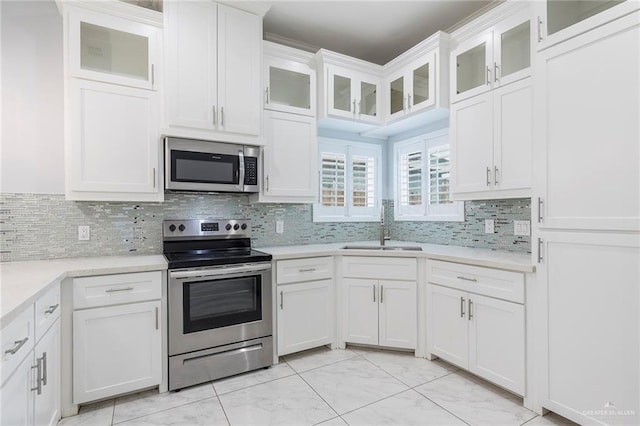 220 Stella Dr, San Juan, TX 78589 - kitchen featuring light countertops, white cabinetry, stainless steel appliances, and a sink
