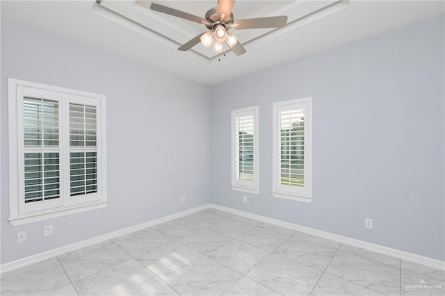 220 Stella Dr, San Juan, TX 78589 - empty room with marble finish floor, baseboards, and ceiling fan