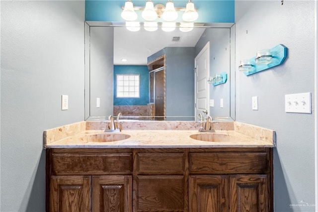 bathroom with vanity and an enclosed shower