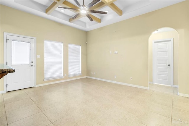 tiled spare room featuring beamed ceiling, ceiling fan, and coffered ceiling