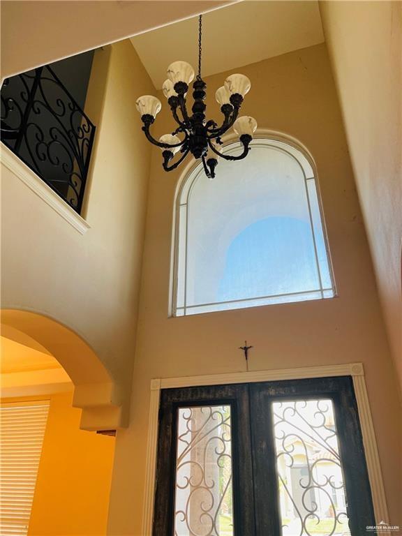 detailed view of a chandelier and arched walkways