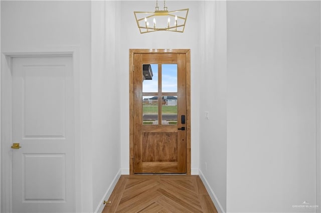 556 Demi St, Edinburg, TX 78542 - doorway to outside featuring an inviting chandelier and baseboards