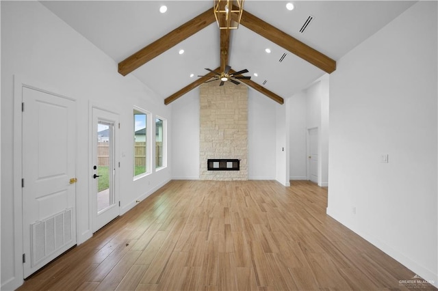 556 Demi St, Edinburg, TX 78542 - unfurnished living room with light wood-style flooring, visible vents, and beam ceiling