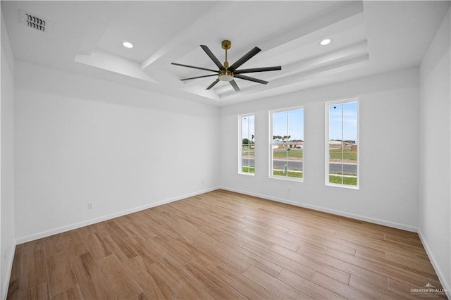 556 Demi St, Edinburg, TX 78542 - unfurnished room featuring a ceiling fan, wood finished floors, and a raised ceiling