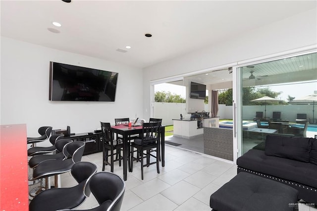 dining room with light tile patterned flooring and recessed lighting