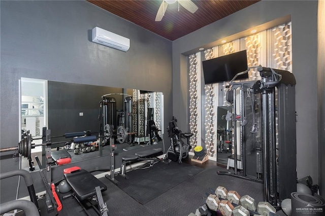 gym with ceiling fan and an AC wall unit