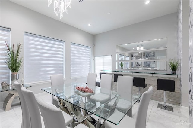 dining room with recessed lighting and an inviting chandelier