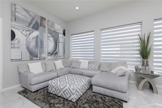 living room with recessed lighting, baseboards, and marble finish floor