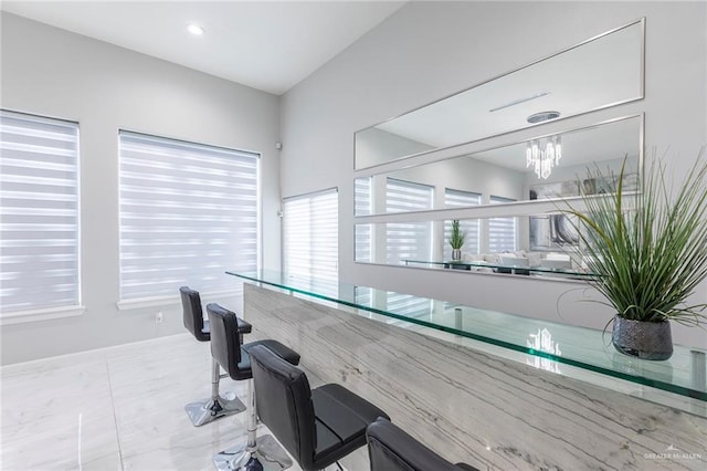 interior space with plenty of natural light, recessed lighting, and a chandelier