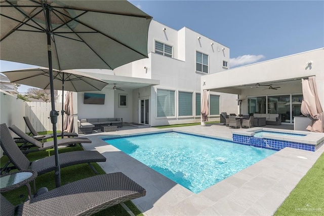 view of pool featuring an outdoor living space, ceiling fan, and a patio area