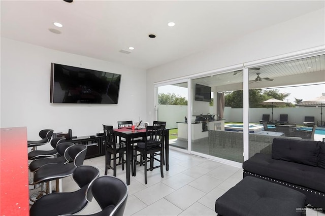 interior space with recessed lighting, a ceiling fan, and light tile patterned floors
