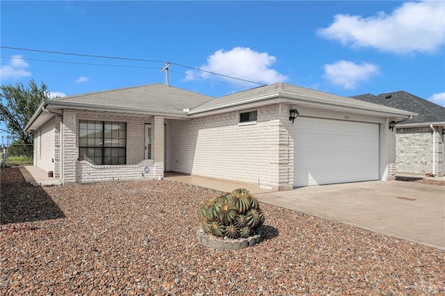 1700 Aries St, Mission, TX 78572 - single story home featuring a garage, brick siding, and driveway