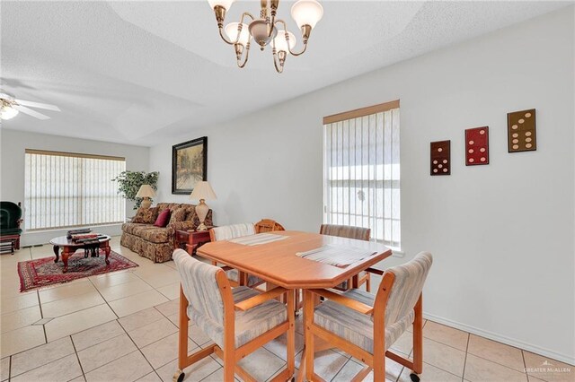 1700 Aries St, Mission, TX 78572 - dining space featuring light tile patterned floors, a chandelier, a ceiling fan, and a textured ceiling