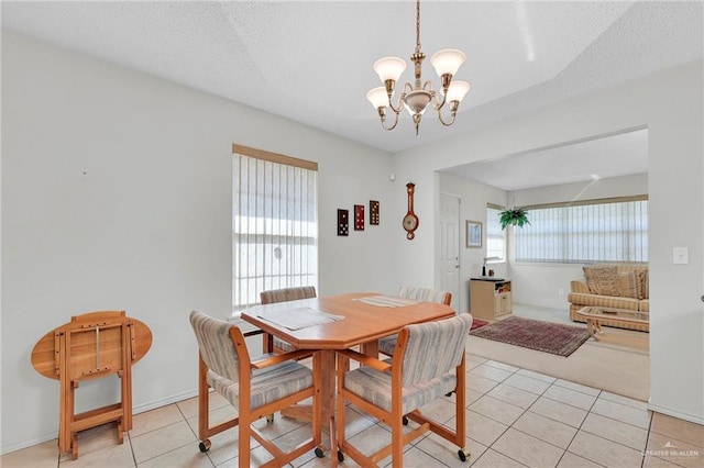 1700 Aries St, Mission, TX 78572 - dining space with a chandelier and light tile patterned floors