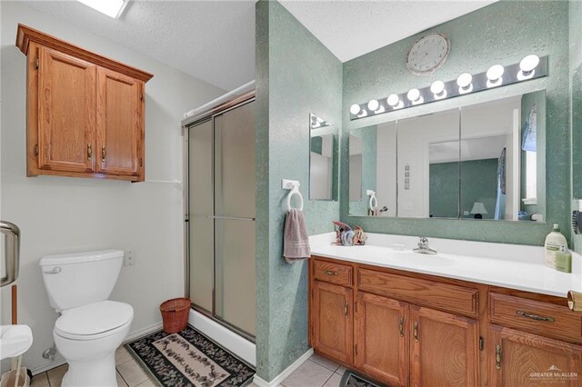 1700 Aries St, Mission, TX 78572 - full bath with tile patterned flooring, a stall shower, and vanity