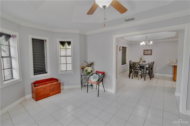 interior space with visible vents, crown molding, light tile patterned floors, baseboards, and ceiling fan with notable chandelier