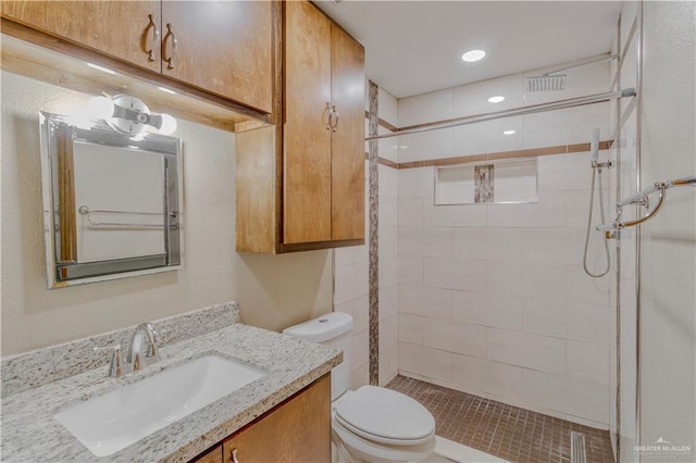 full bathroom with visible vents, a shower stall, vanity, toilet, and recessed lighting
