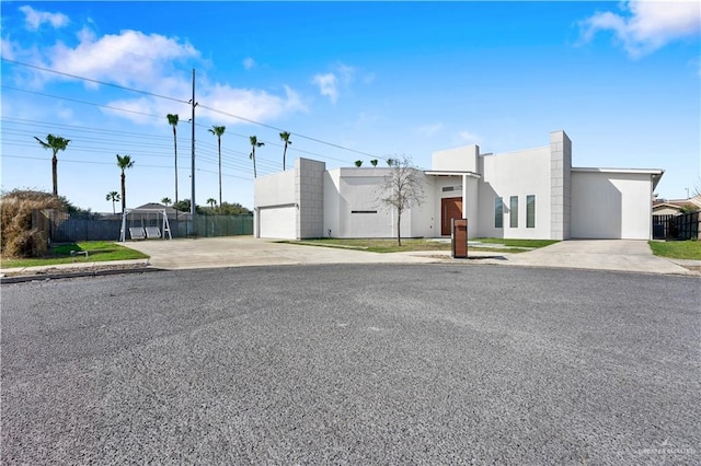 exterior space with fence and stucco siding