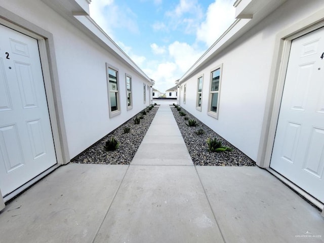 view of side of property with a patio