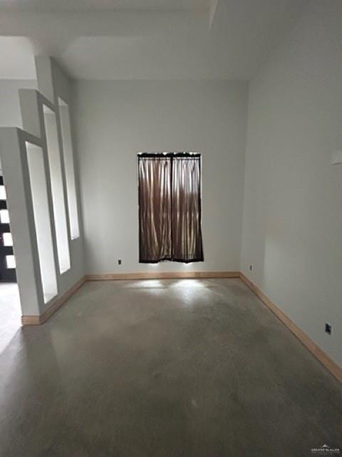 spare room featuring concrete flooring