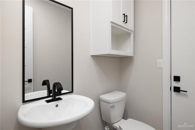 bathroom with sink and toilet