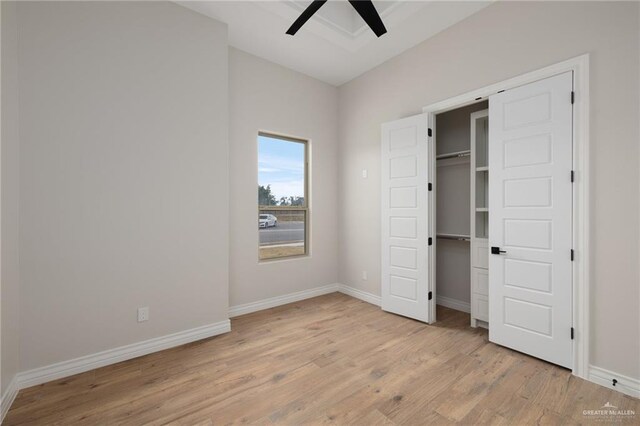 unfurnished bedroom with ceiling fan and light hardwood / wood-style floors