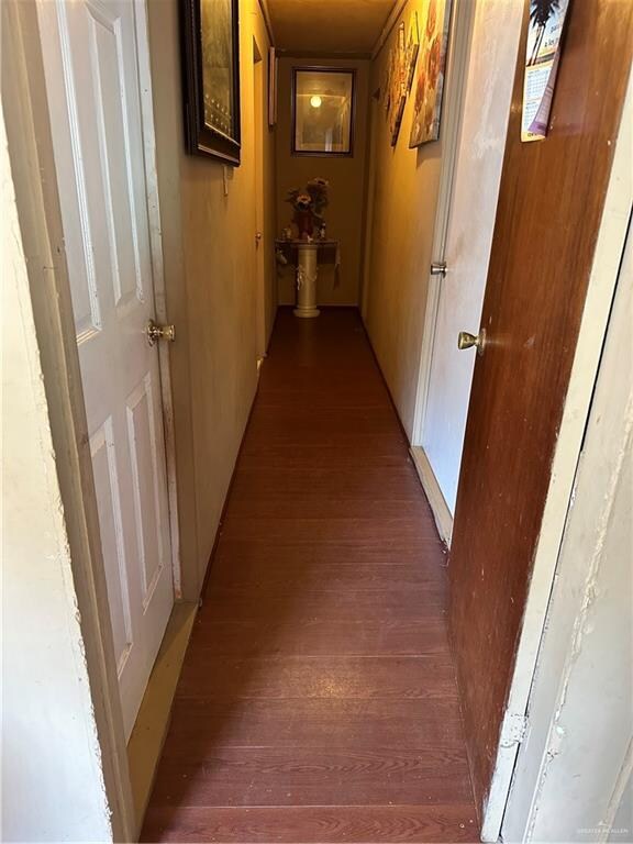 corridor with dark hardwood / wood-style floors