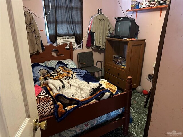 bedroom featuring carpet flooring and cooling unit