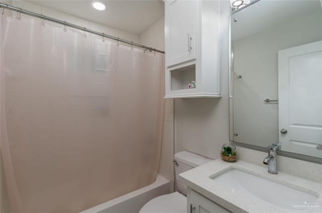 full bathroom with vanity, toilet, and shower / bath combo with shower curtain