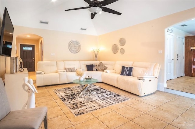 6800 N 15th Ln, Mcallen, TX 78504 - tiled living room featuring arched walkways, vaulted ceiling, and a ceiling fan