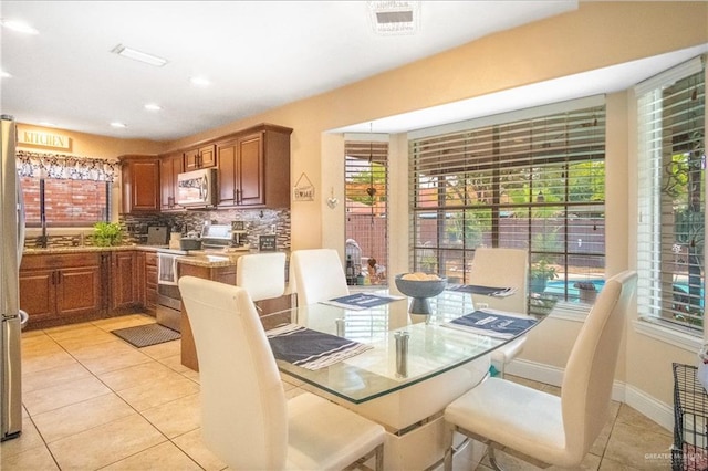 6800 N 15th Ln, Mcallen, TX 78504 - dining room with light tile patterned flooring and recessed lighting